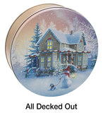 Round decorative tin with a winter holiday illustration showing a snow-covered house, trees, a snowman, and a dog under falling snow. The text 'All Decked Out' appears below the tin on a white background.